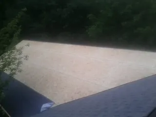 New OSB roof sheathing installed beside an existing shingle roof in Rosemead